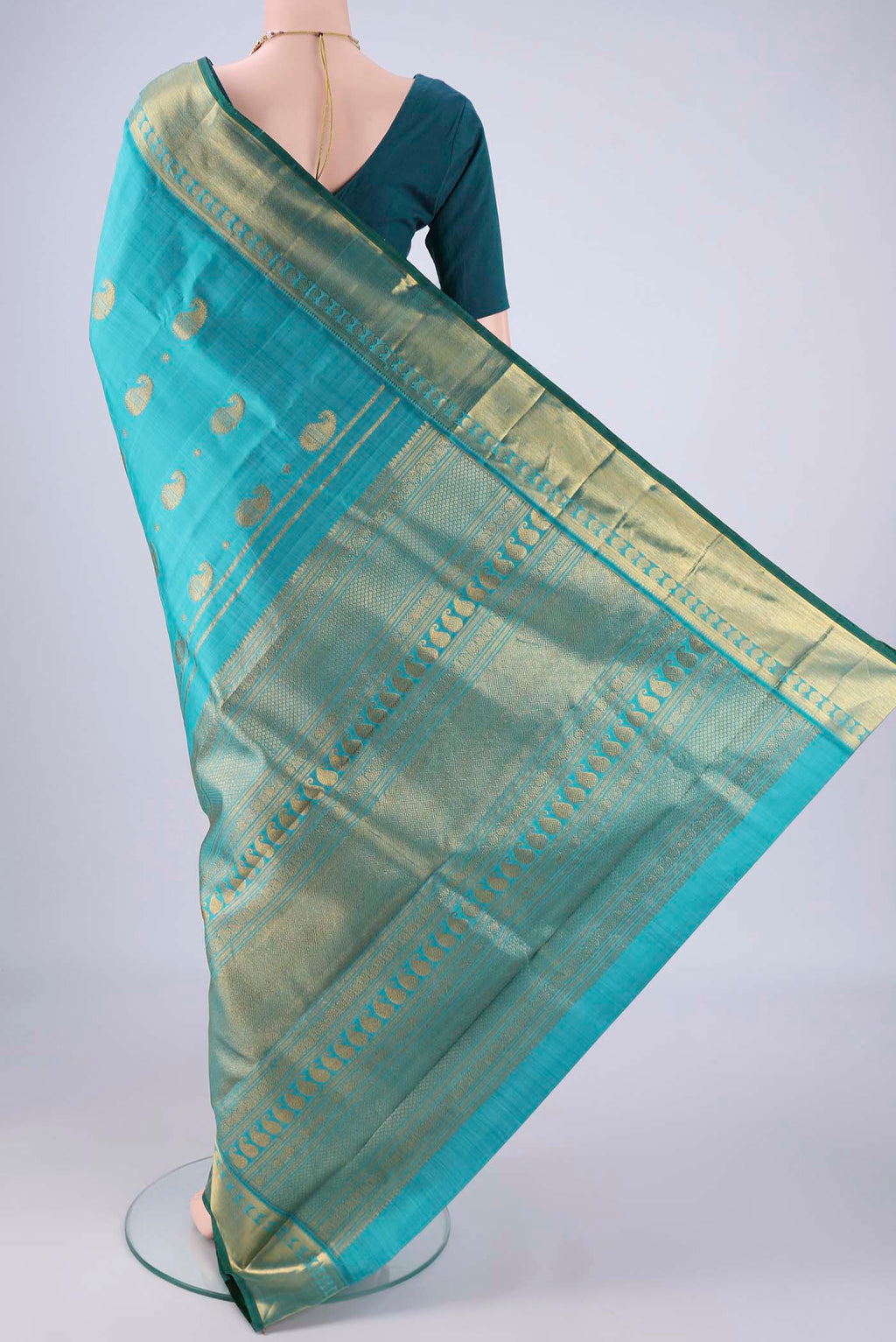 Flat view of Blue Kanjivaram Silk Saree with Zari Butta on the body and Zari Border. 