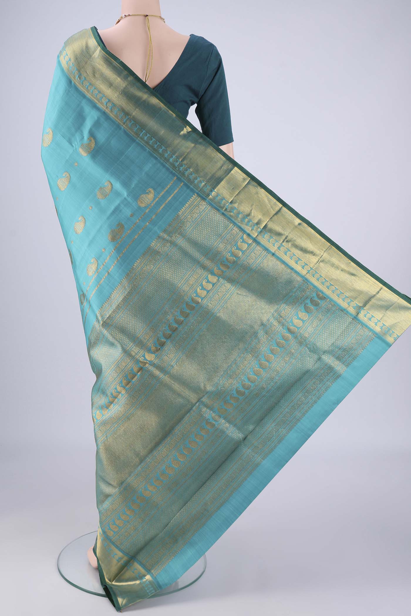 Flat view of Blue Kanjivaram Silk Saree with Zari Butta on the body and Zari Border. 