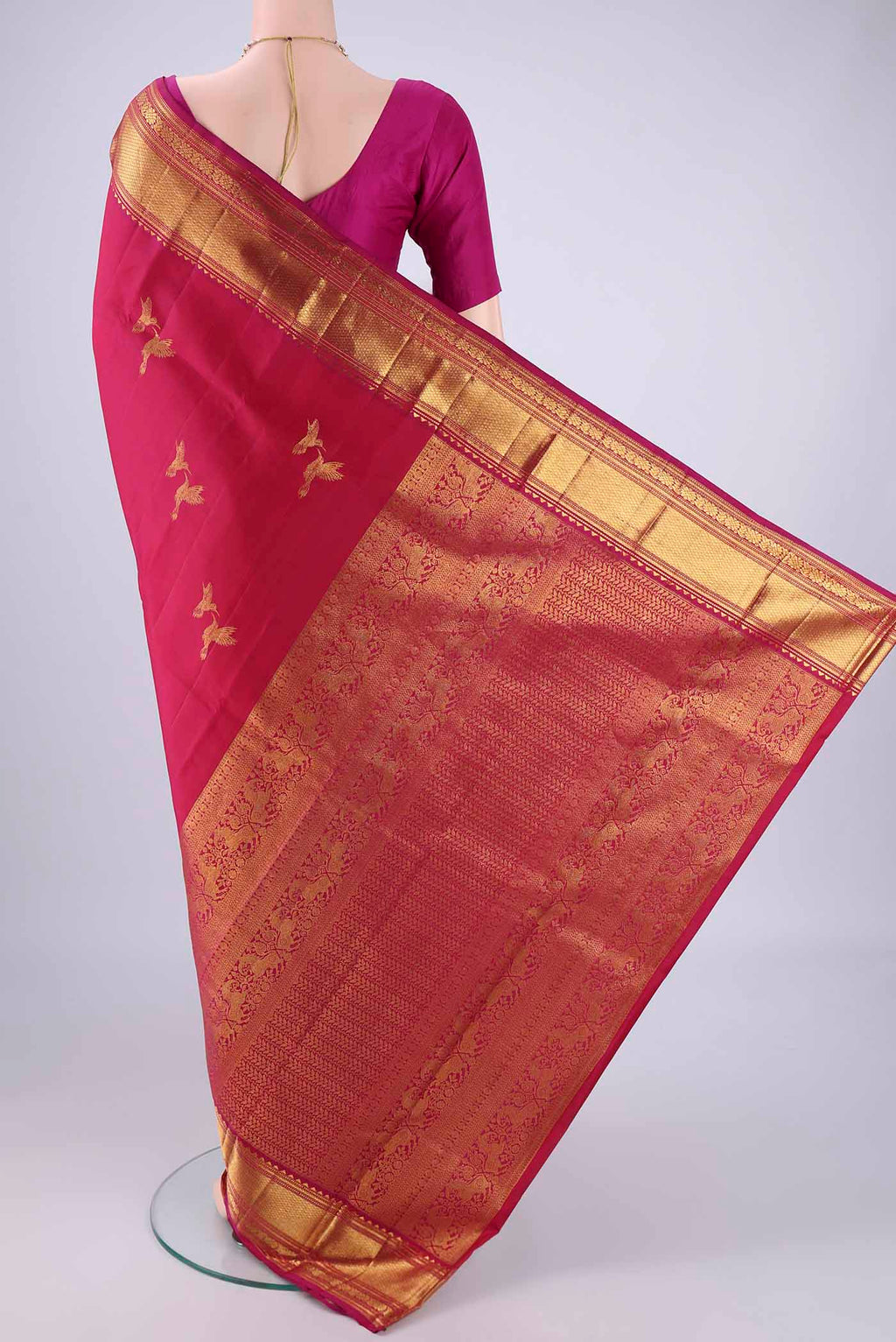 Flat view of Dark Pink Kanjivaram Silk Saree with Zari Butta on the body and Zari Border. 