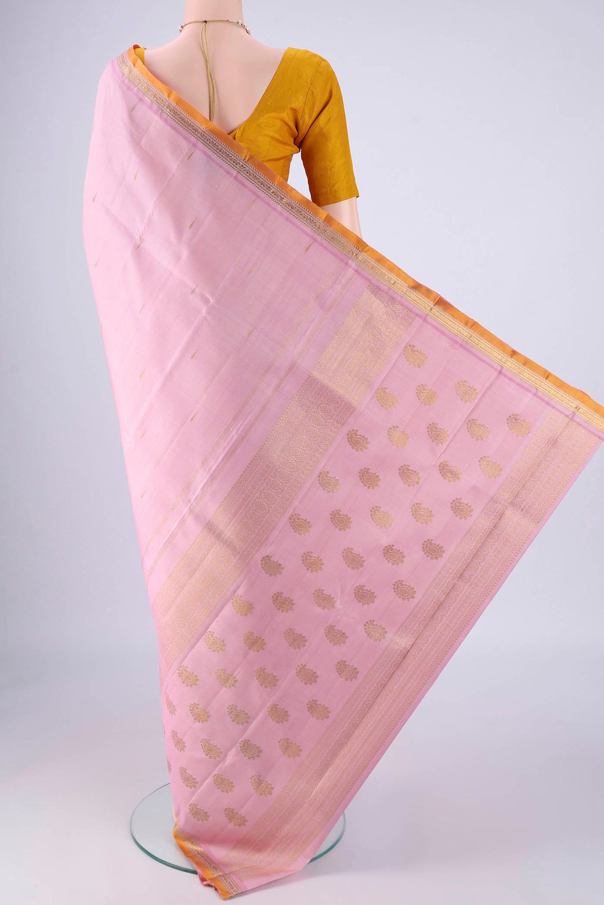 Flat view of Rose pink Kanjivaram Silk Saree with Zari Butta on the body and Zari Border. 