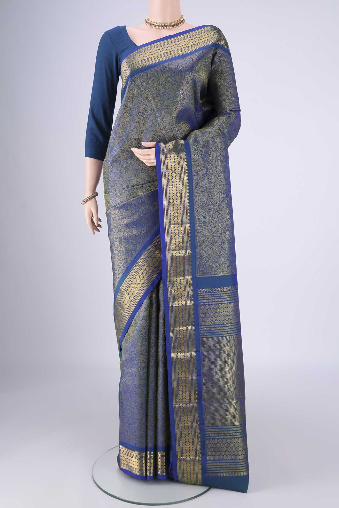 Pure Silk Pure Zari Blue Kanjivaram Saree with Zari Brocade on the body and Zari Border.  displayed on a mannequin