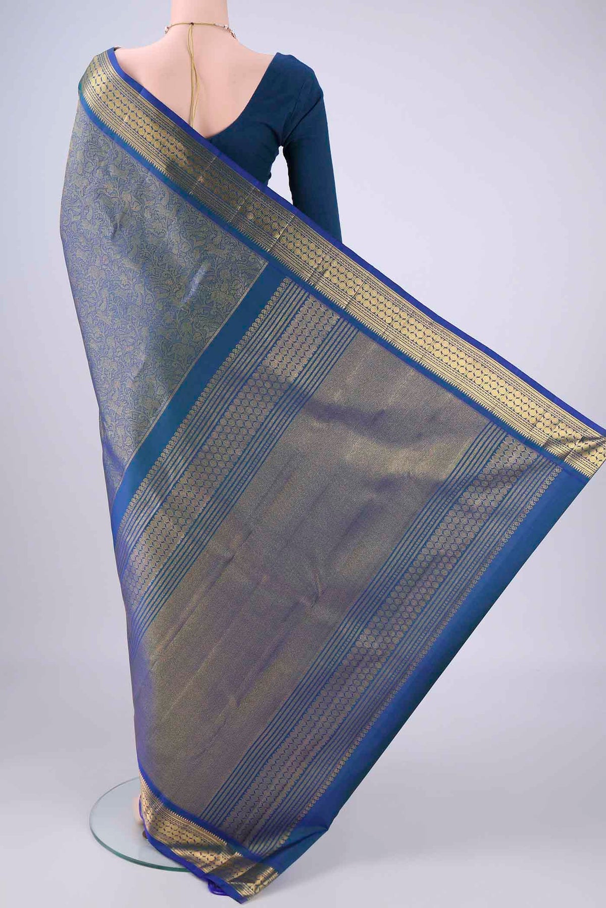Flat view of Pure Silk Pure Zari Blue Kanjivaram Saree with Zari Brocade on the body and Zari Border. 