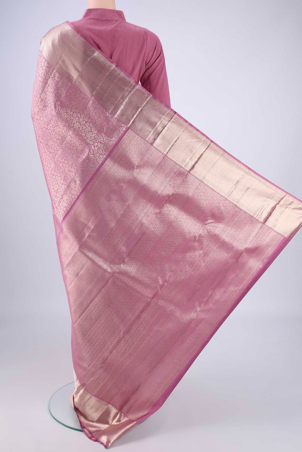 Flat view of Mauve Kanchipuram Silk Saree with Zari Brocade on the body and Zari Border. 