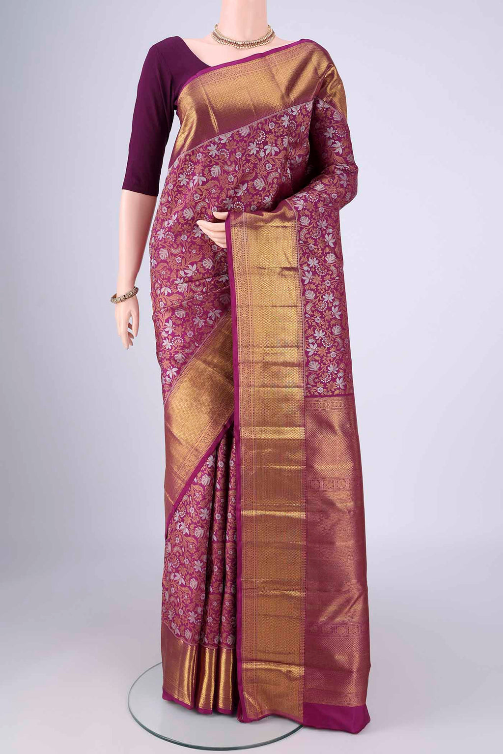 Purple Kanjivaram Silk Saree with Zari Brocade on the body and Zari Border.  displayed on a mannequin