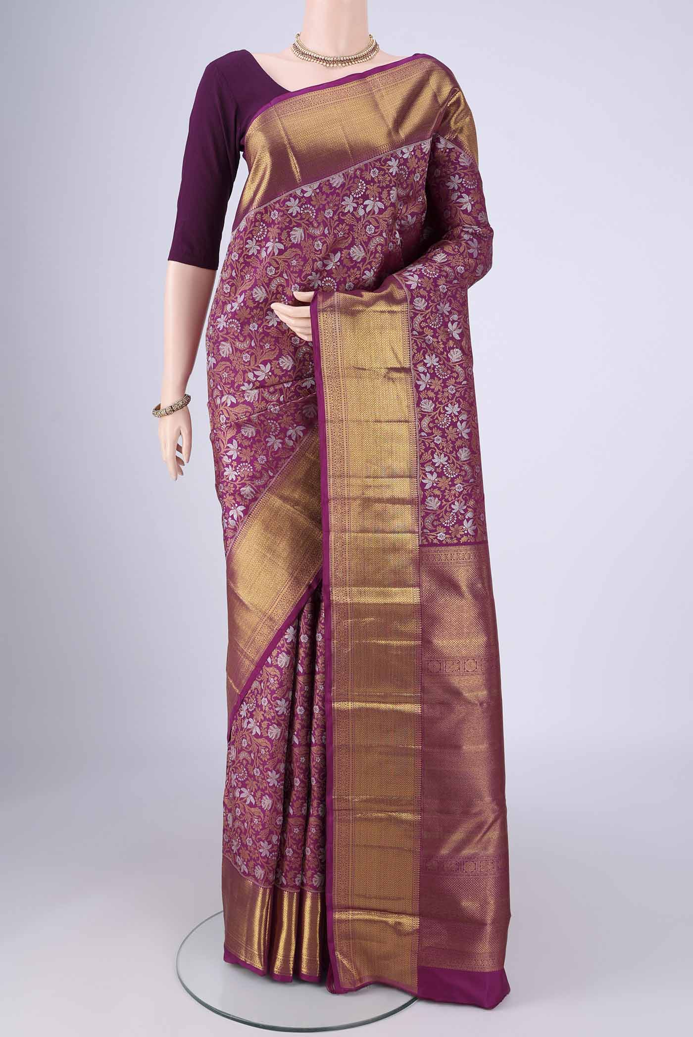 Purple Kanjivaram Silk Saree with Zari Brocade on the body and Zari Border.  displayed on a mannequin
