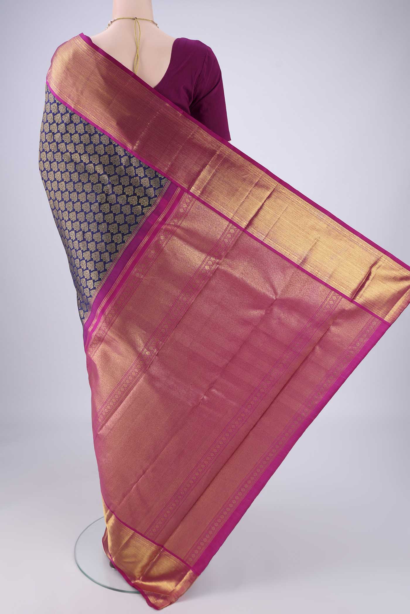 Flat view of Navy Blue Kanjivaram Silk Saree with Zari Brocade on the body and Zari Border. 
