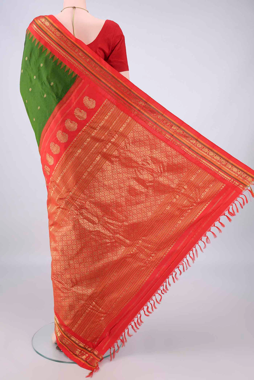 Flat view of Pure Silk Green Gadwal Saree with Zari Butta on the body and Zari Border. 