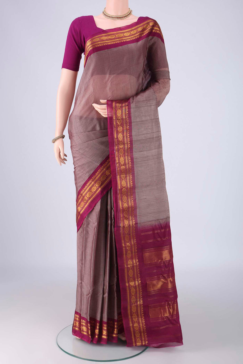 Grey Gadwal cotton Saree with Stripes on the body and Zari Border.  displayed on a mannequin