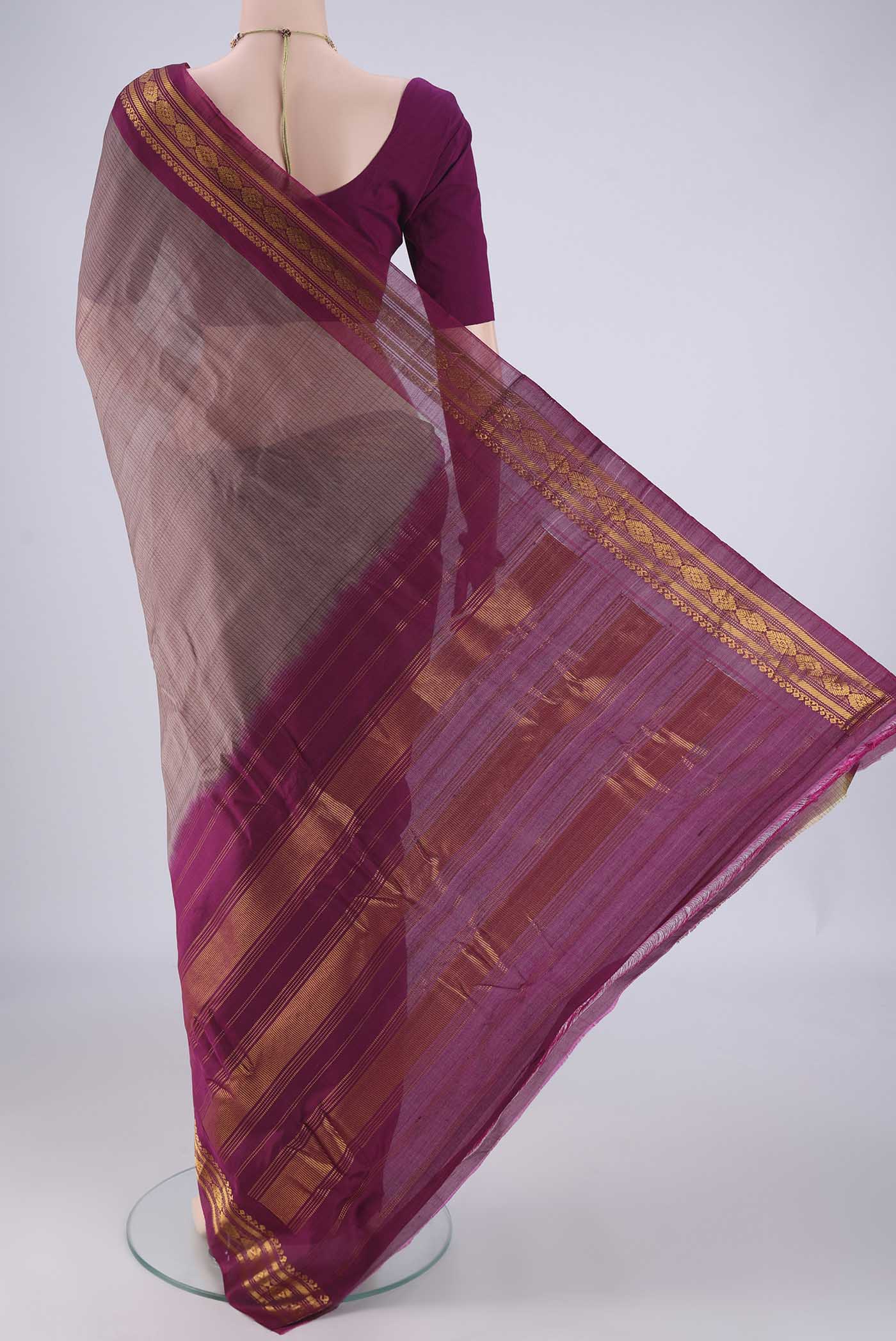 Flat view of Grey Gadwal cotton Saree with Stripes on the body and Zari Border. 