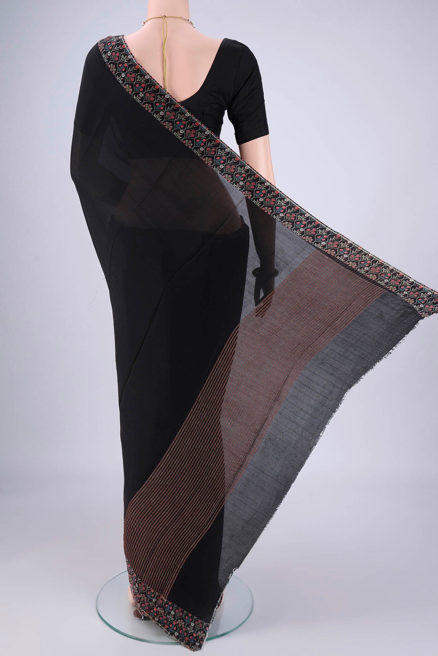 Flat view of Black Mysore Crepe Saree with Plain Body and Printed Border. 