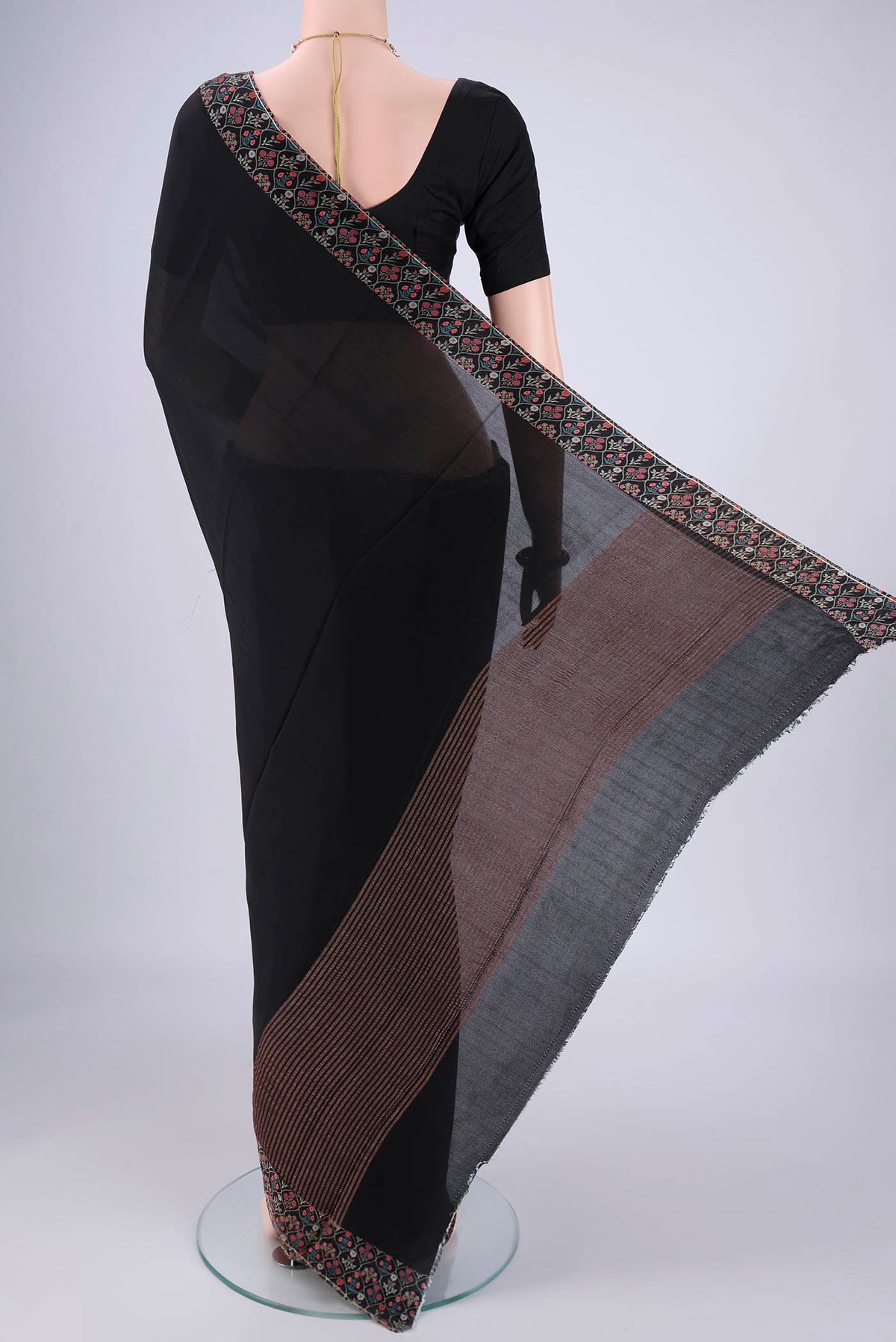 Flat view of Black Mysore Crepe Saree with Plain Body and Printed Border. 
