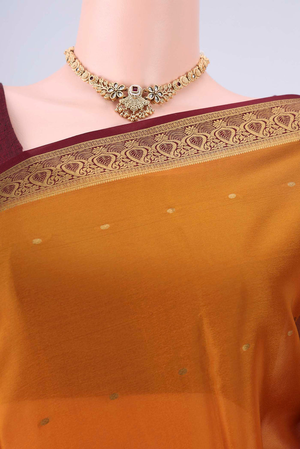 Border image of Mustard Mysore Crepe Saree with Zari Butta on the body and Zari Border. 
