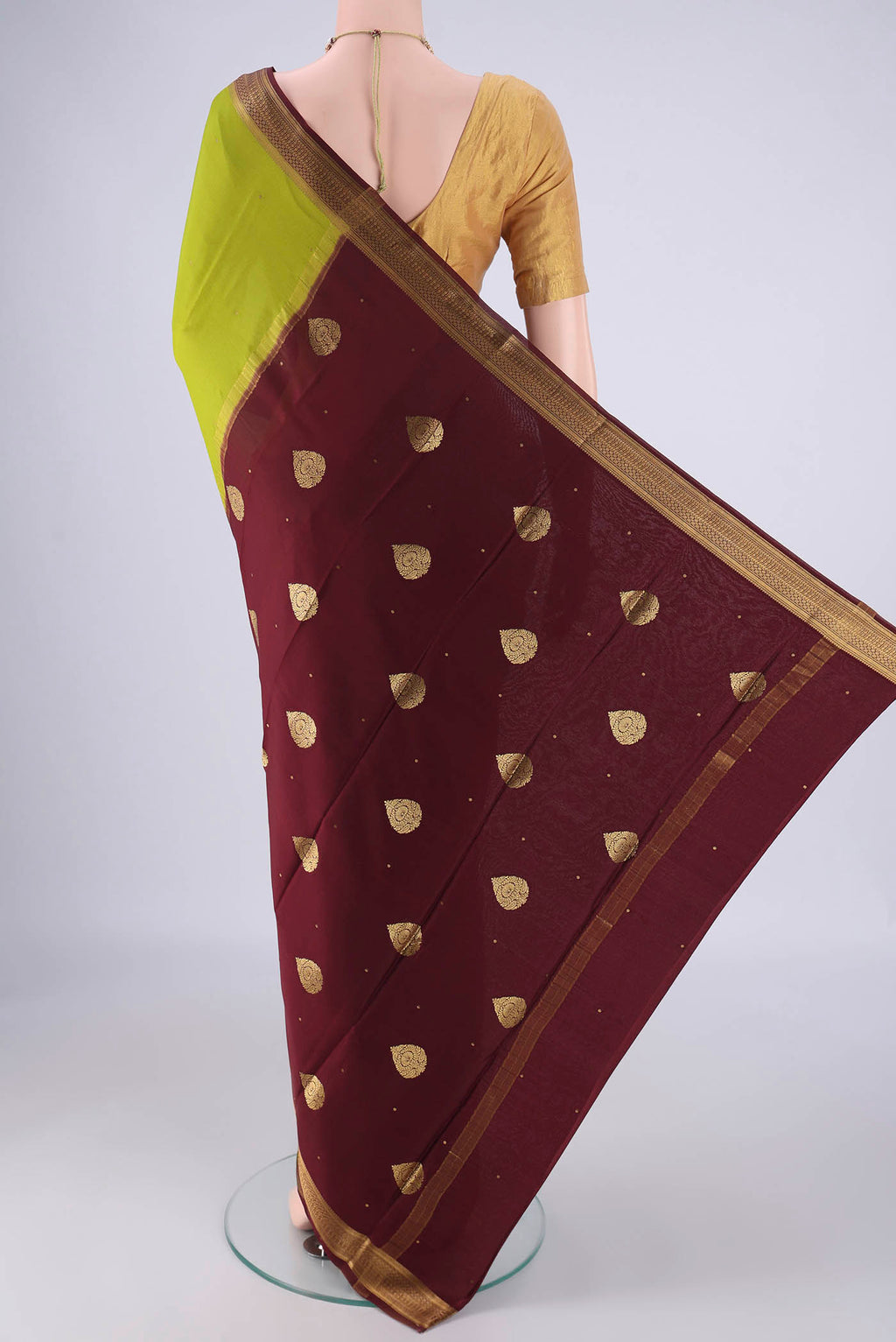 Flat view of Acid Green Mysore Crepe Saree with Zari Butta on the body and Zari Border. 