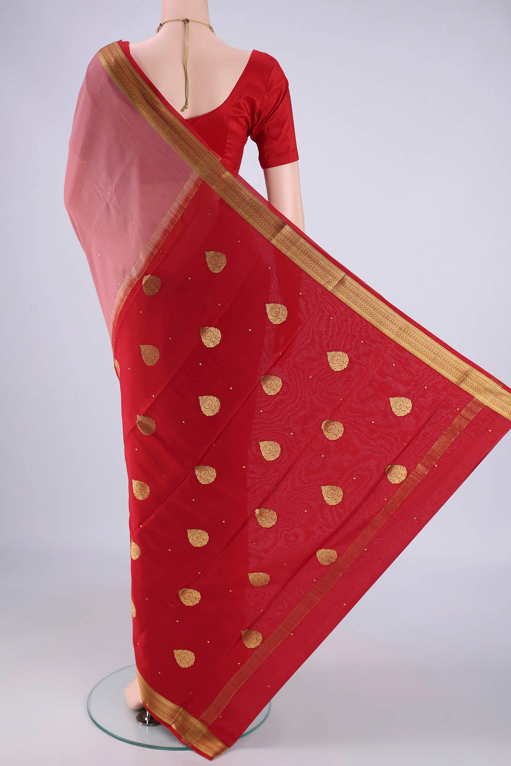 Flat view of Coral Mysore Crepe Saree with Zari Butta on the body and Zari Border. 
