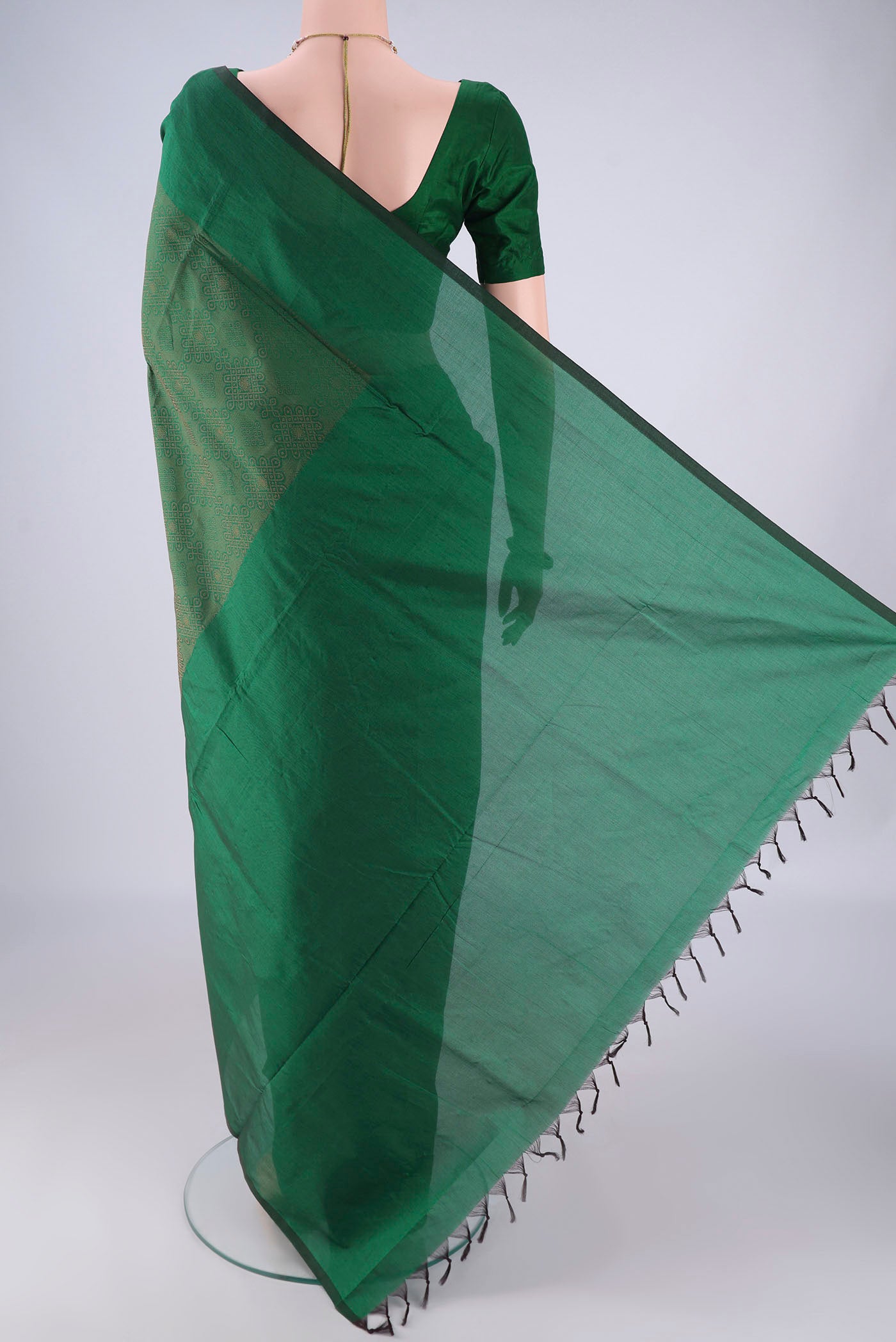 Flat view of Bottle Green Blended Poly Cotton Saree with Jacquard design on the body and Plain Border. 