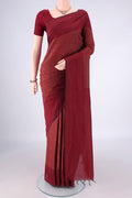 Maroon Blended Poly Cotton Saree with Jacquard design on the body and Thread Border.  displayed on a mannequin