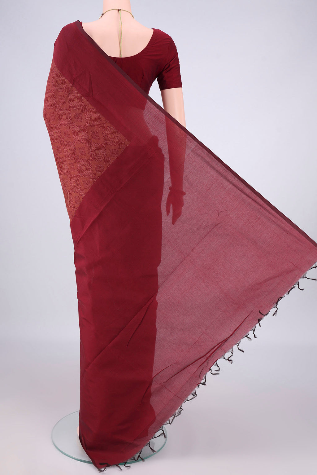 Flat view of Maroon Blended Poly Cotton Saree with Jacquard design on the body and Thread Border. 