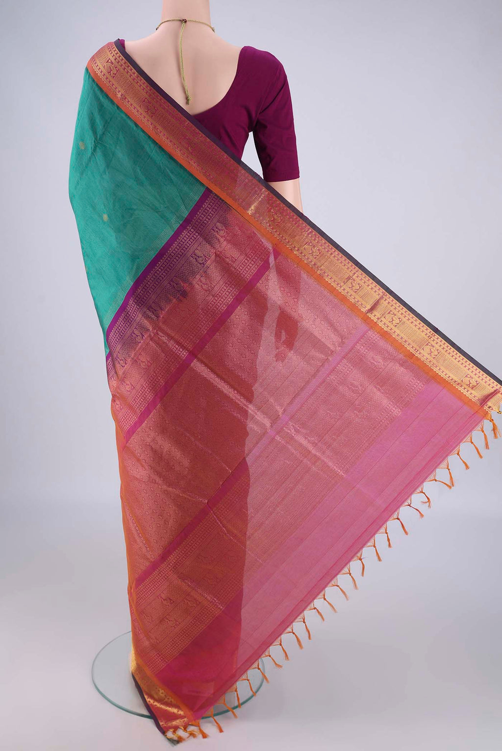 Flat view of Sea Green Silk Cotton Saree with Zari Butta on the body and Zari Border. 