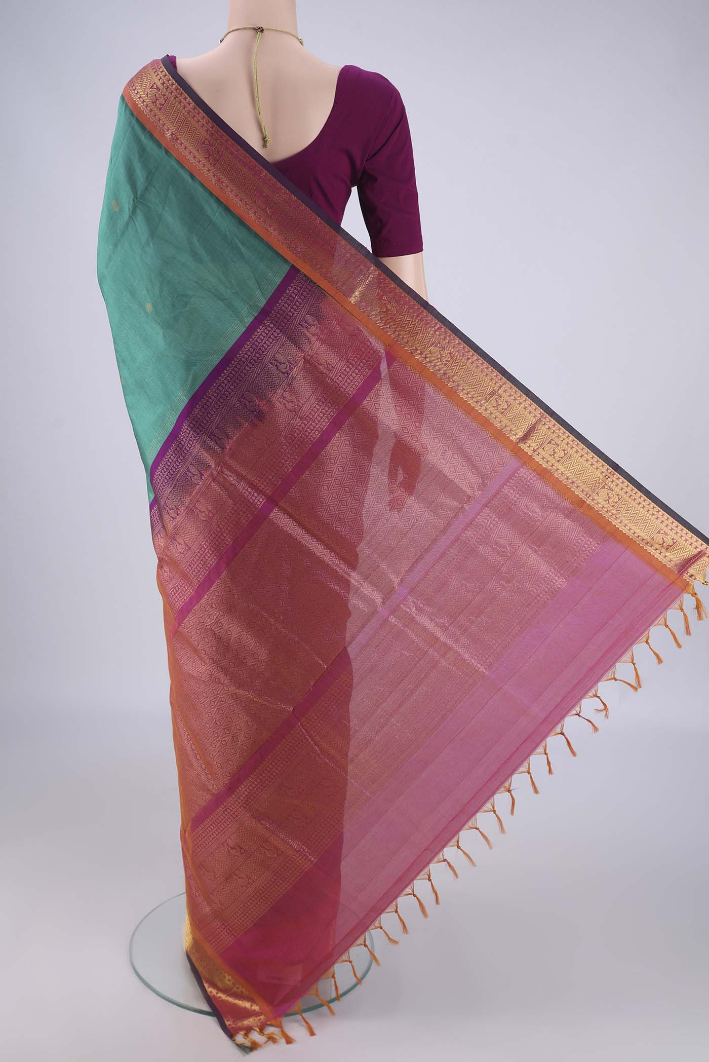 Flat view of Sea Green Silk Cotton Saree with Zari Butta on the body and Zari Border. 