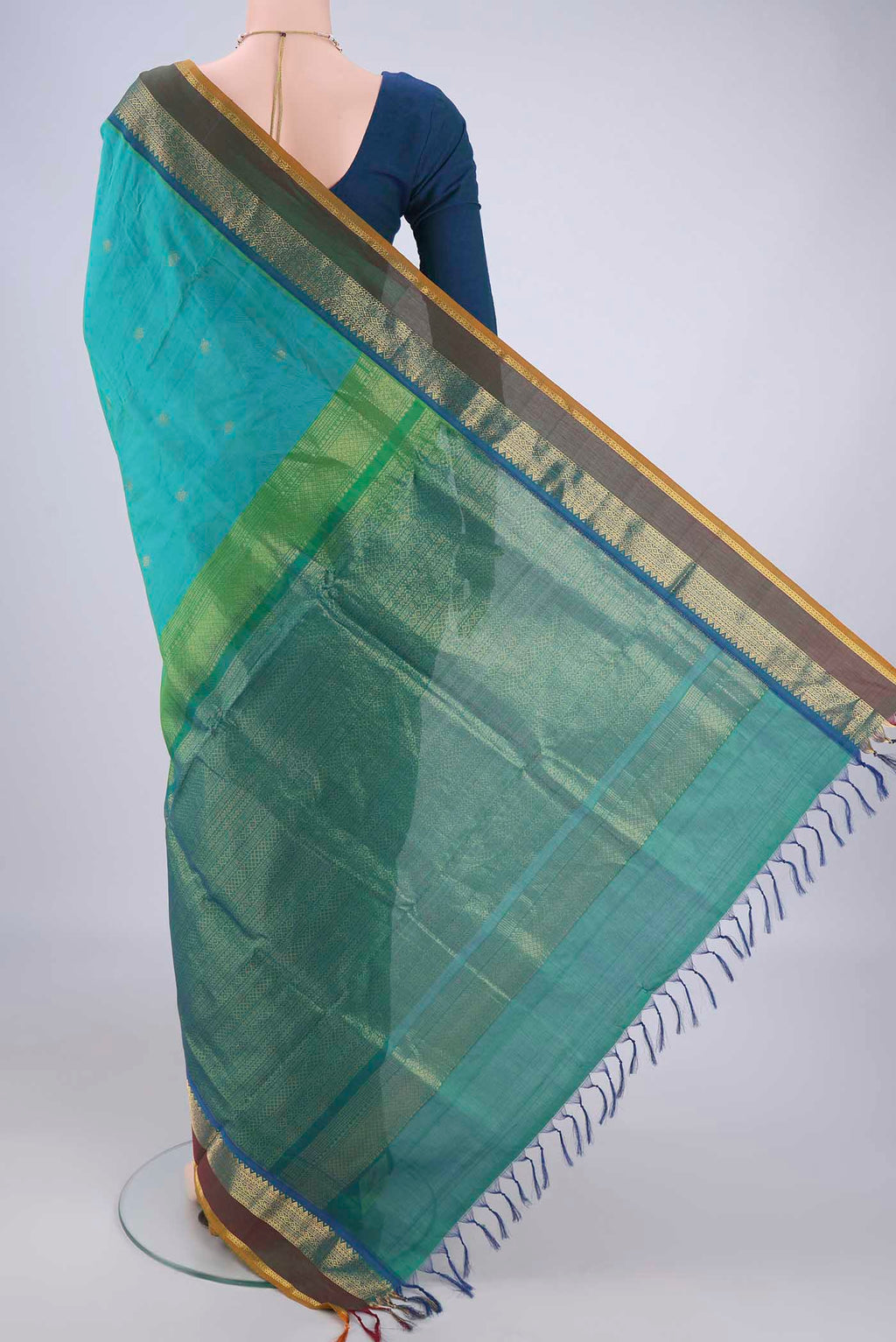 Flat view of Sea Green Coimbatore Silk Cotton Saree with Zari Butta on the body and Zari Border. 