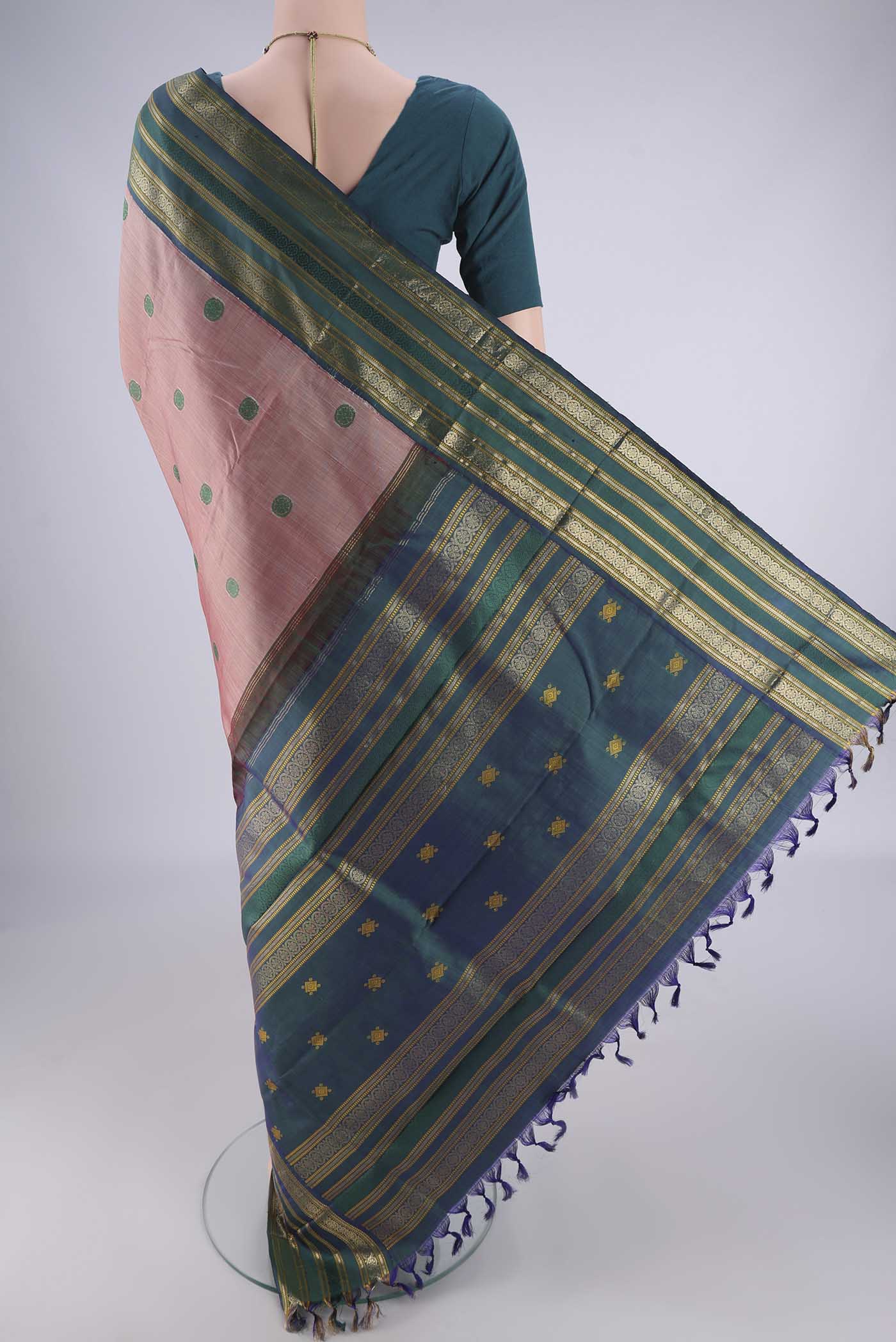 Flat view of Rose Gold Kanjivaram Silk Saree with Thread Butta on the body and Zari Border. 