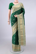 Pure Silk Green Kanchipuram Saree with Thread Butta on the body and Zari And Thread Border.  displayed on a mannequin