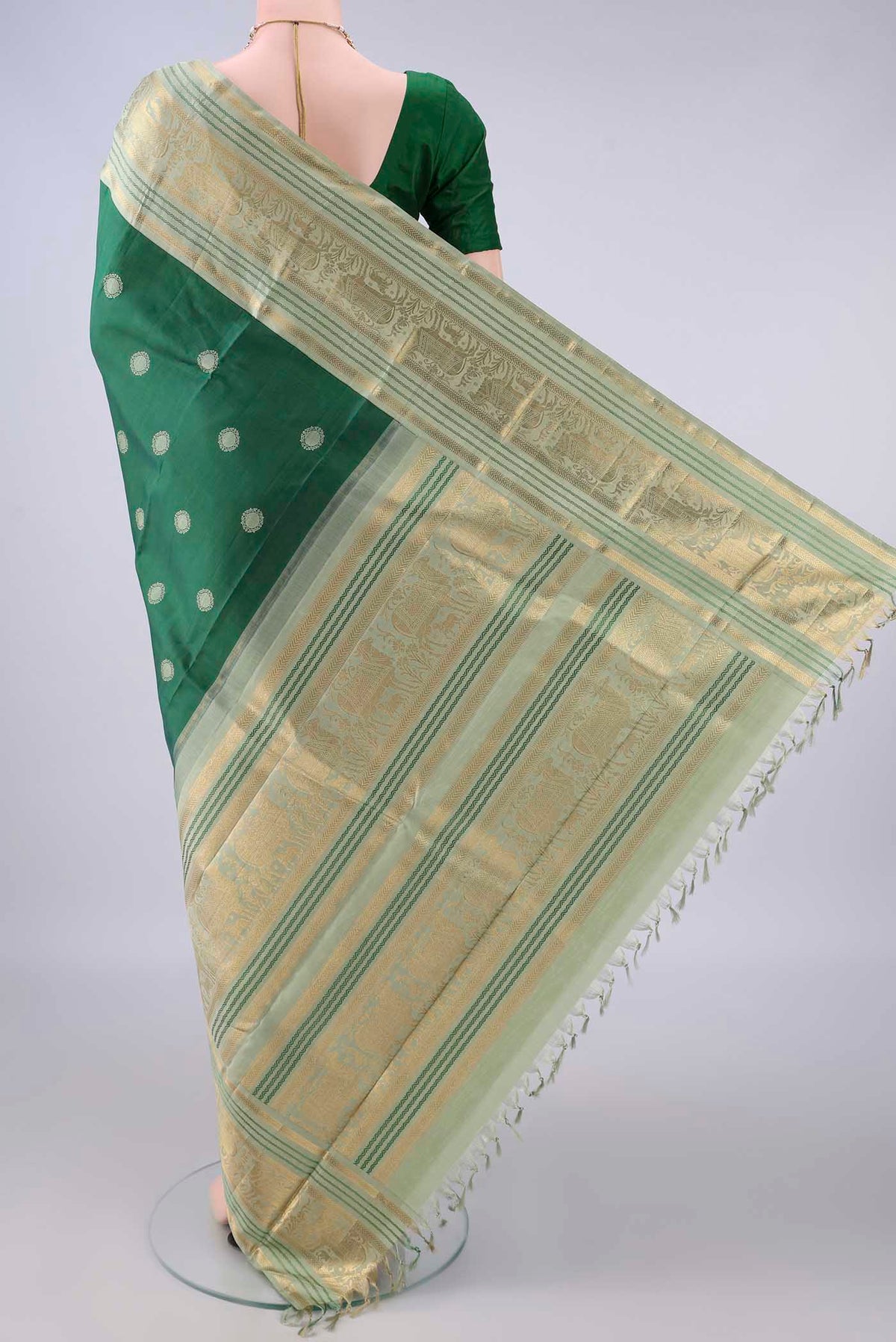 Flat view of Pure Silk Green Kanchipuram Saree with Thread Butta on the body and Zari And Thread Border. 