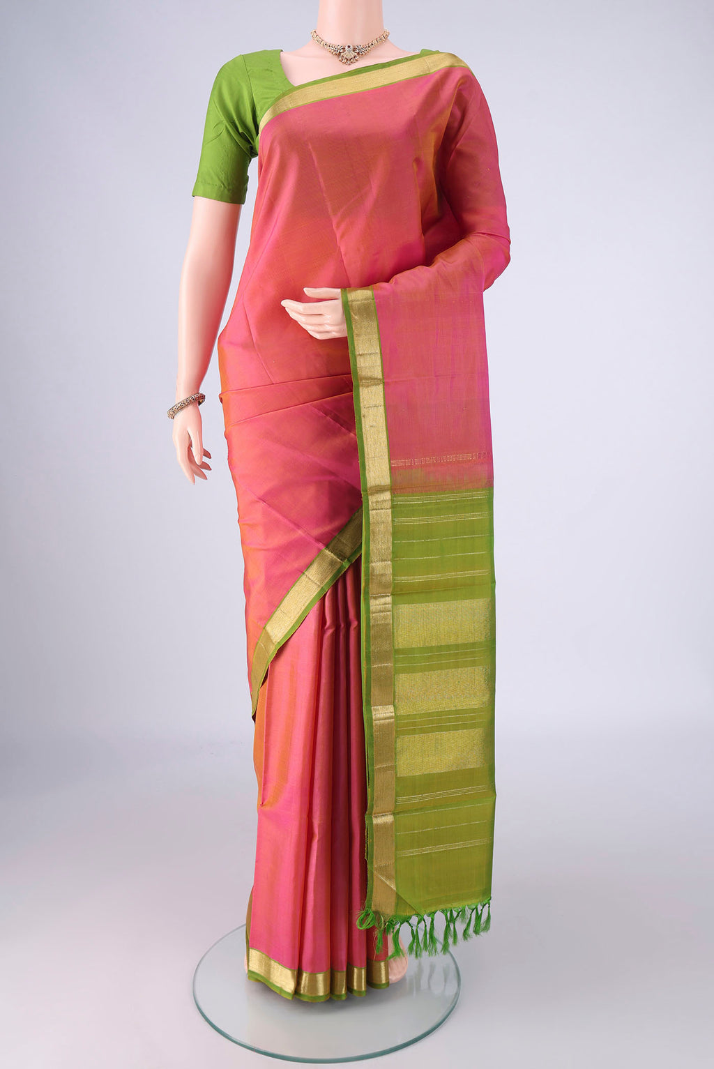 Pink Kanjivaram Silk Saree with Plain Body and Zari Border.  displayed on a mannequin