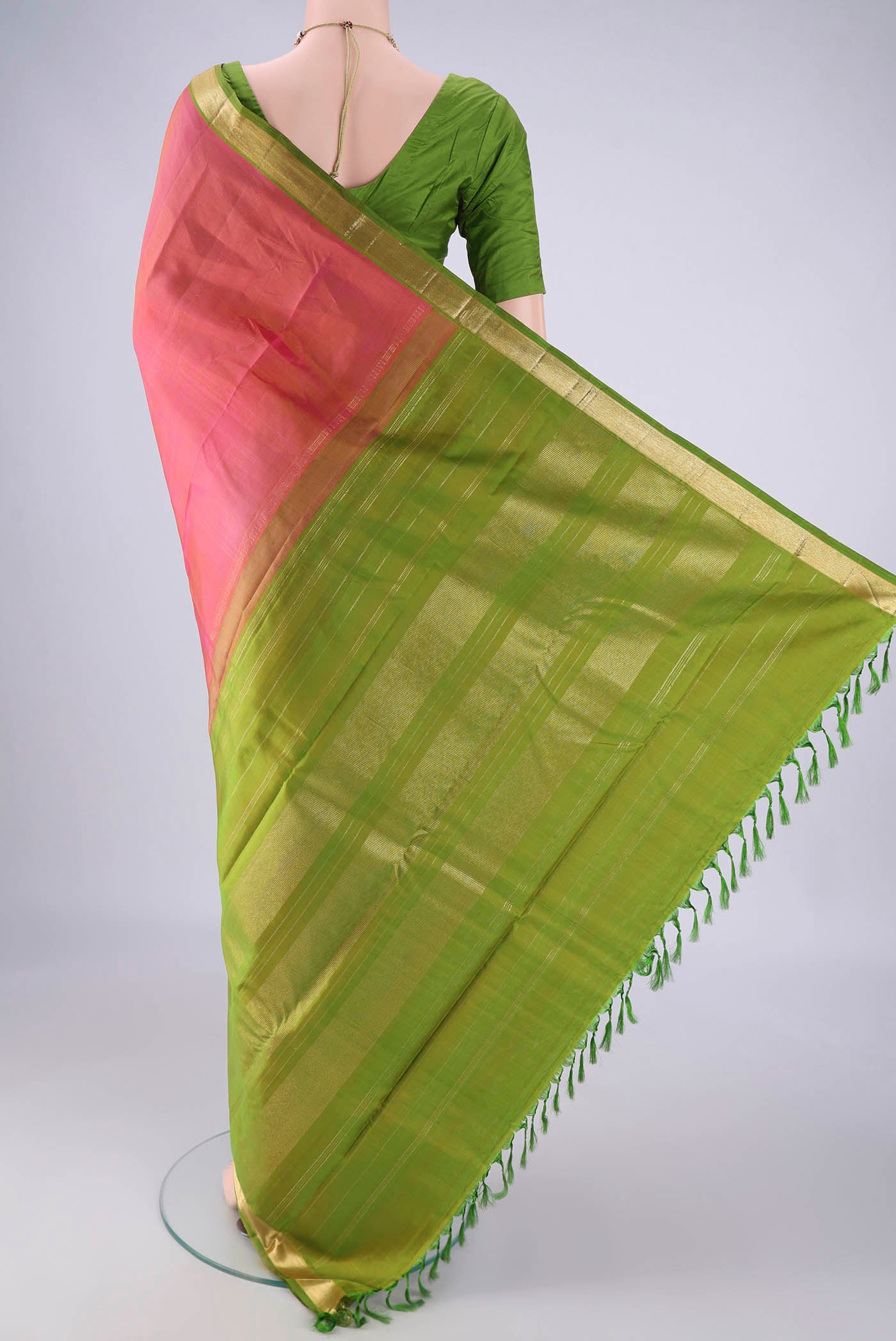 Flat view of Pink Kanjivaram Silk Saree with Plain Body and Zari Border. 