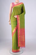 Green Kanjivaram Silk Saree with Plain Body and Zari Border.  displayed on a mannequin
