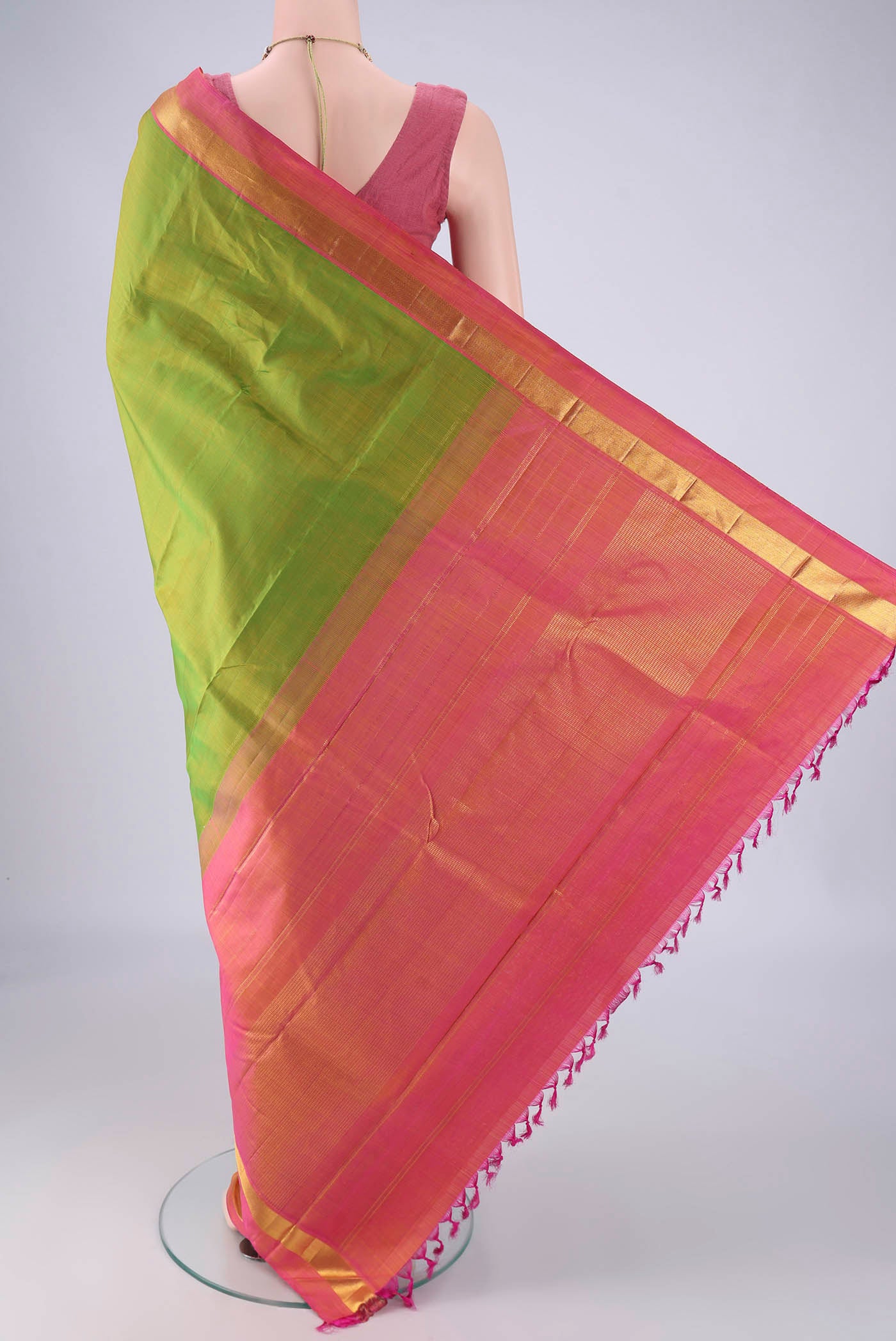 Flat view of Green Kanjivaram Silk Saree with Plain Body and Zari Border. 