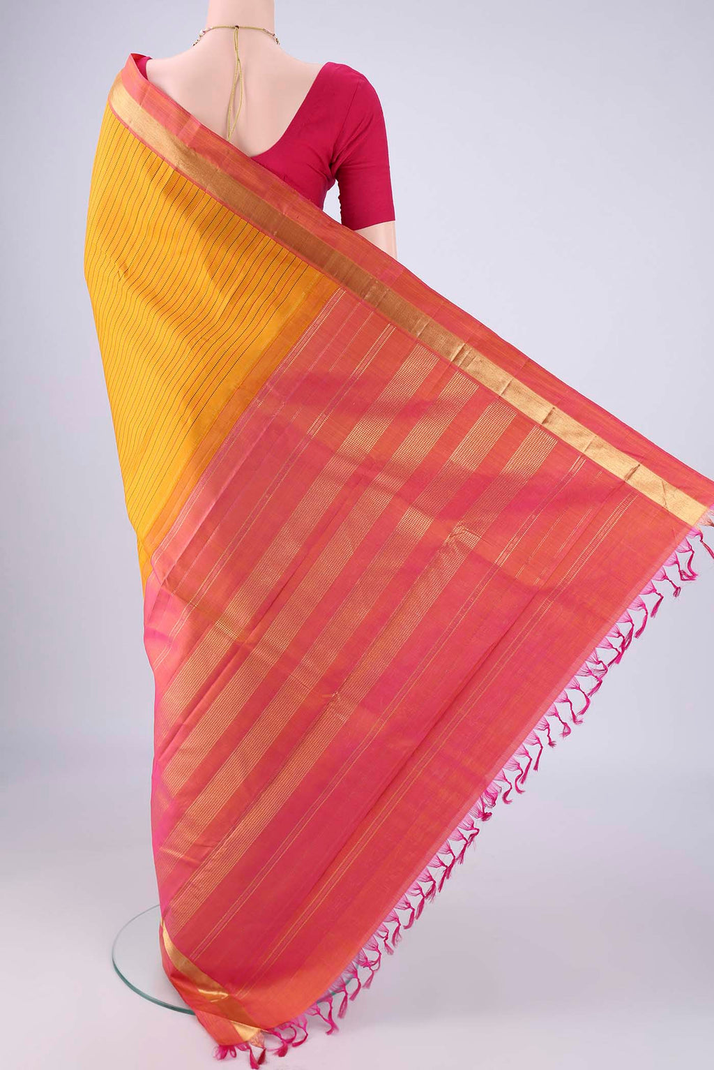 Flat view of Yellow Kanchipuram Silk Saree with Stripes on the body and Zari Border. 
