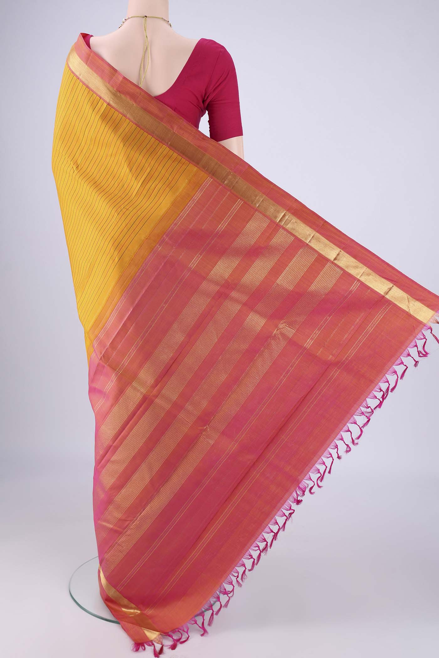 Flat view of Yellow Kanchipuram Silk Saree with Stripes on the body and Zari Border. 