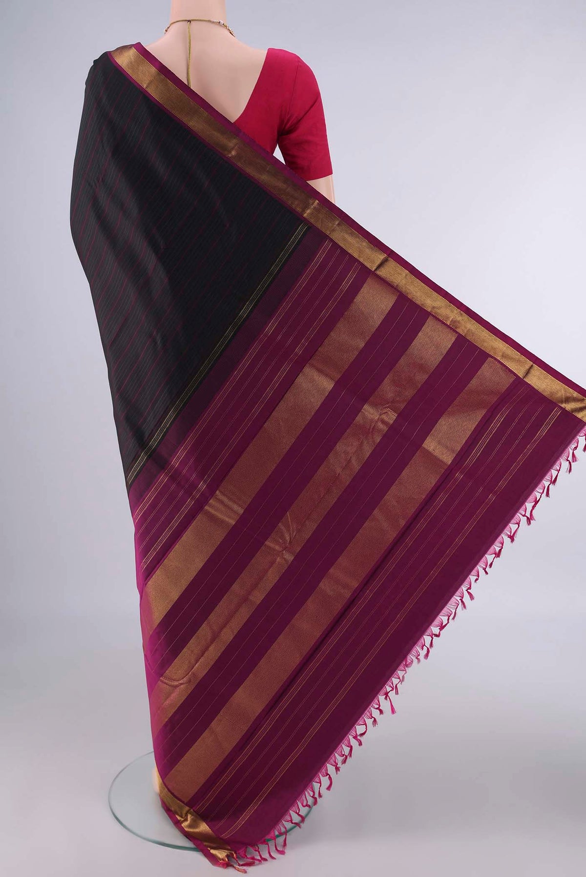 Flat view of Pure Silk Black Kanchipuram Saree with Stripes on the body and Zari Border. 