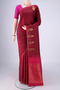Maroon Kanchipuram Silk Saree with Plain Body and Zari Border.  displayed on a mannequin