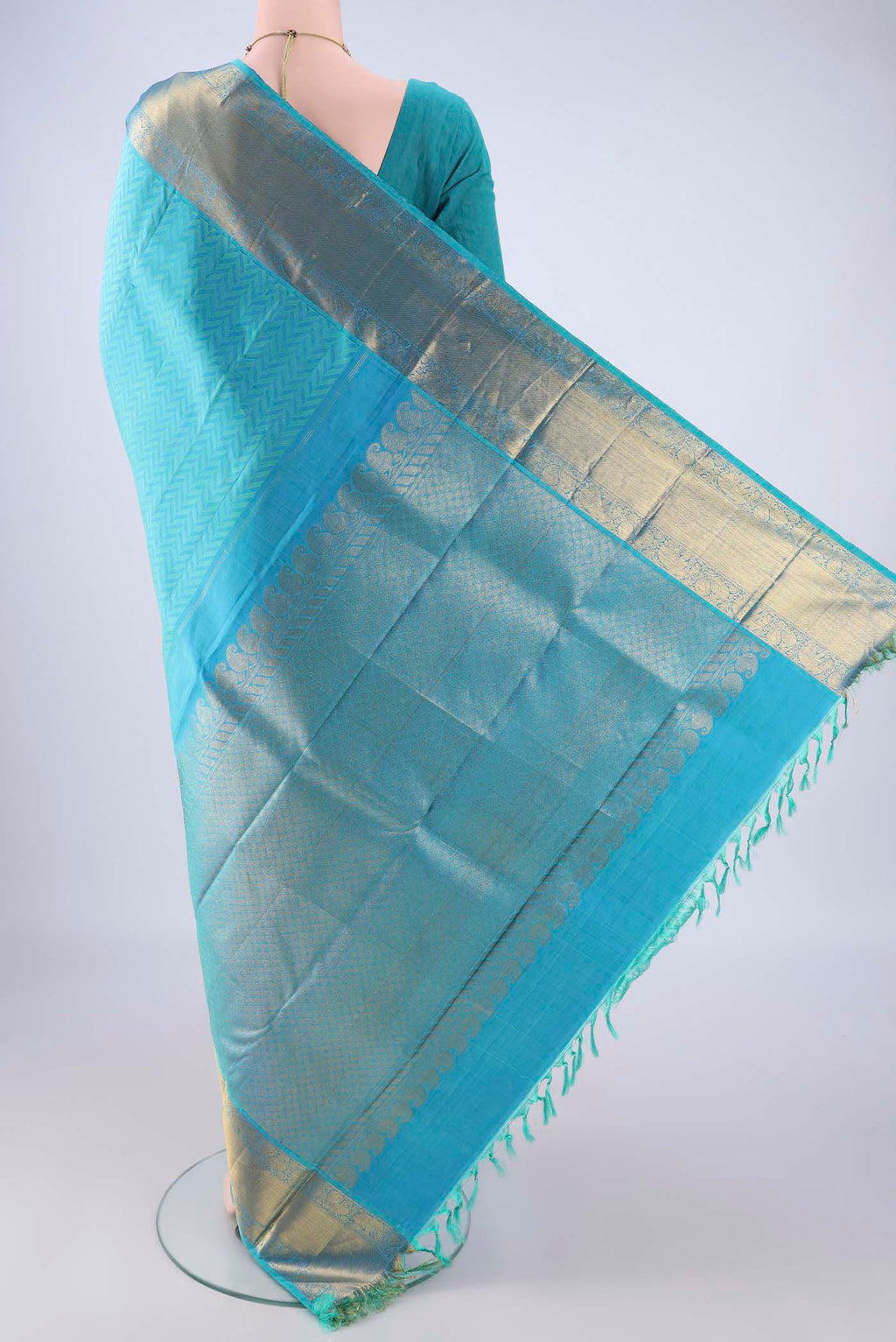 Flat view of Sky Blue Kanjivaram Silk Saree with Jacquard design on the body and Zari Border. 