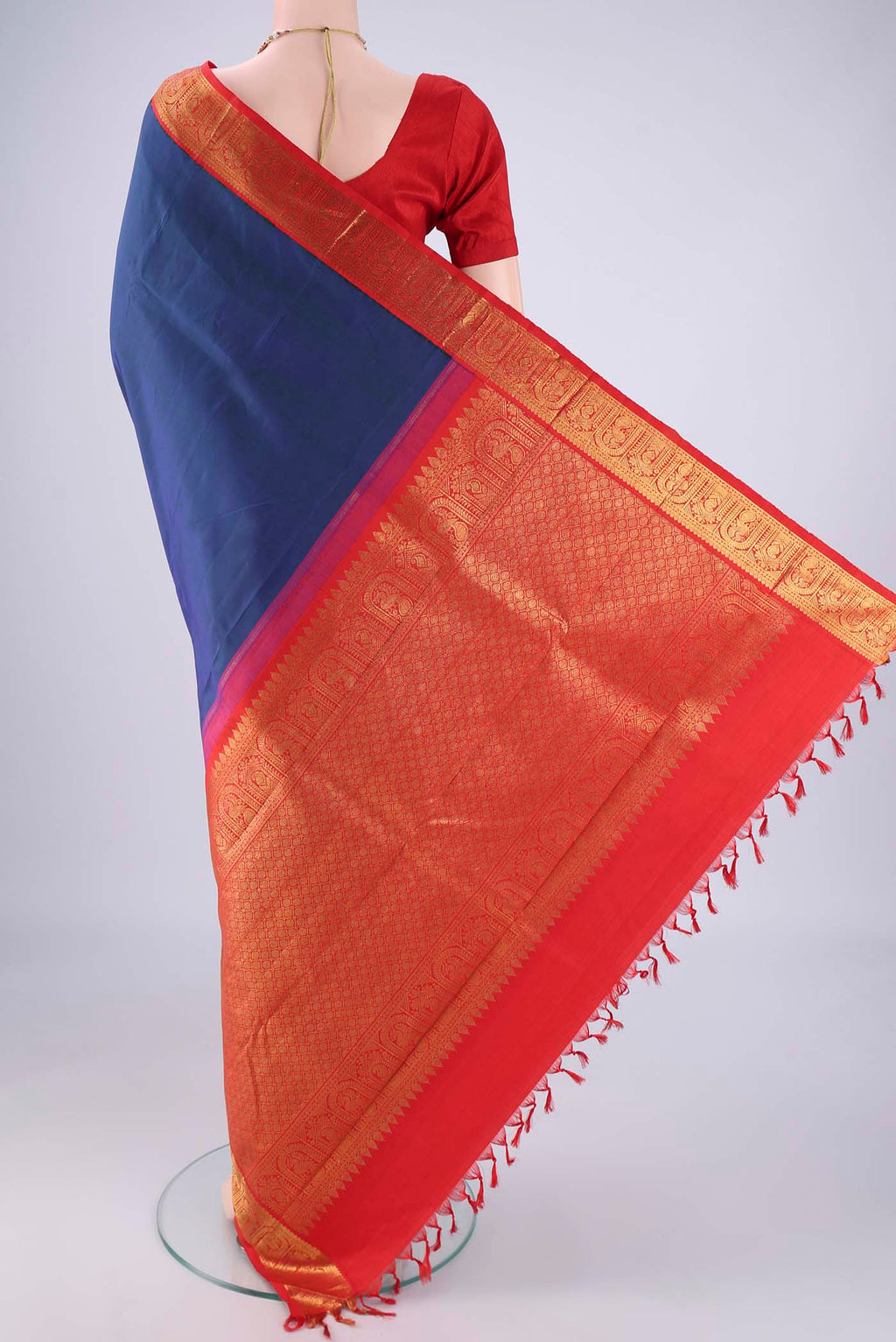Flat view of Dark Blue Kanjivaram Silk Saree with Plain Body and Zari Border. 