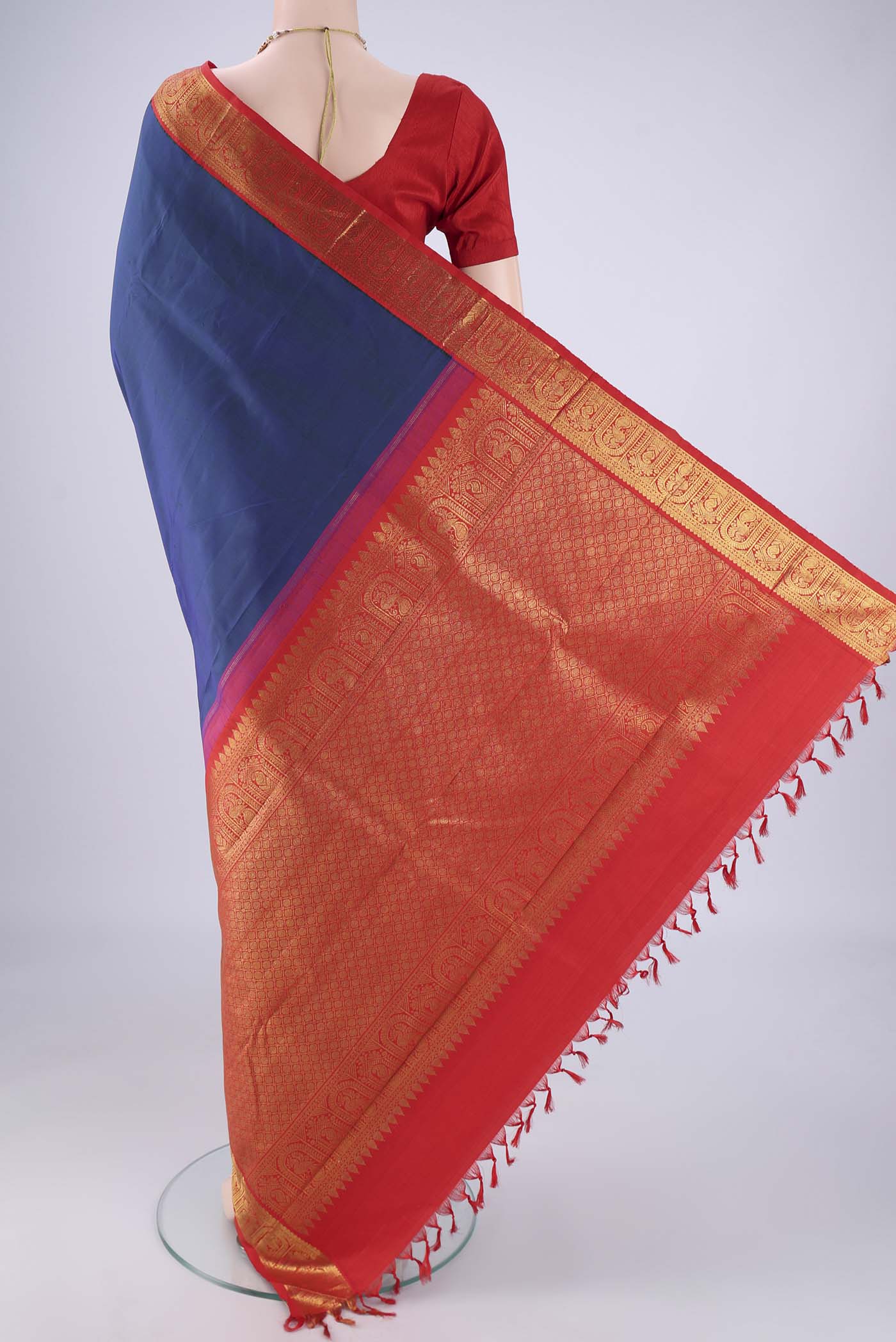 Flat view of Dark Blue Kanjivaram Silk Saree with Plain Body and Zari Border. 