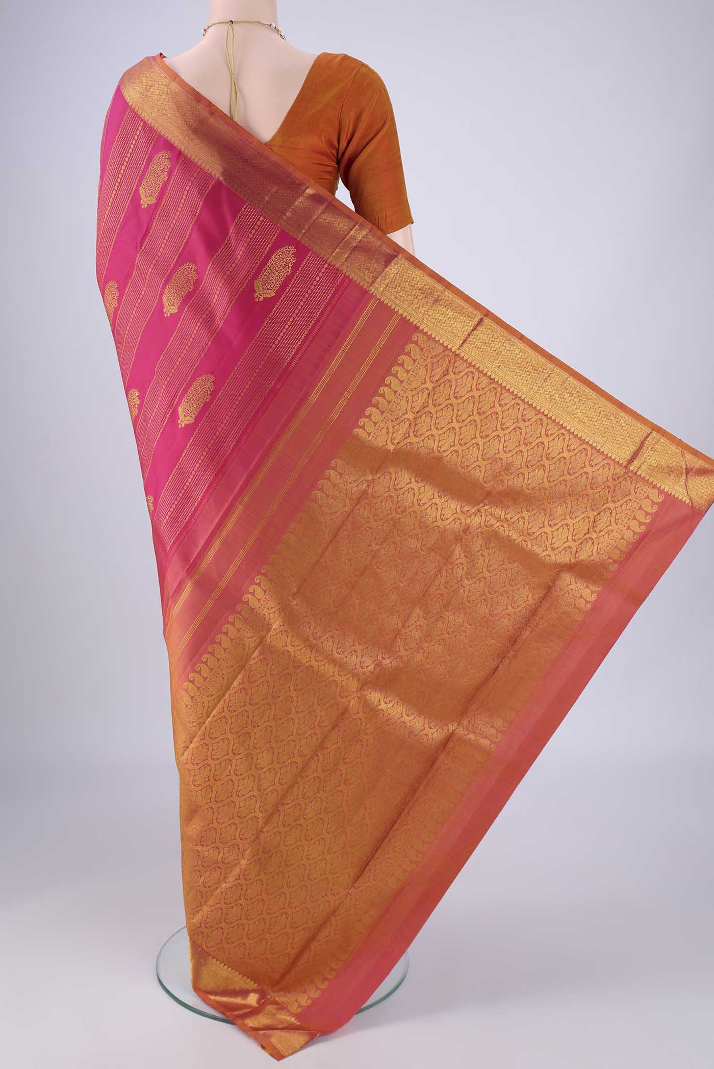 Flat view of Pink Kanjivaram Silk Saree with Zari Brocade on the body and Zari Border. 