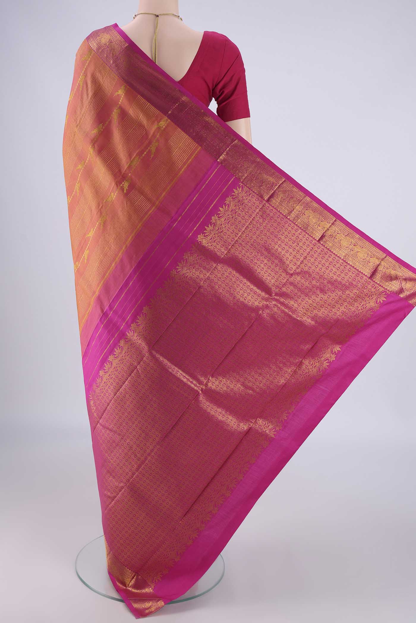 Flat view of Brick Orange Dual Tone Kanjivaram Silk Saree with Stripes on the body and Zari Border. 