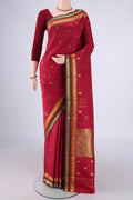 Maroon Kanjivaram Silk Saree with Zari And Thread Butta on the body and Zari Border.  displayed on a mannequin