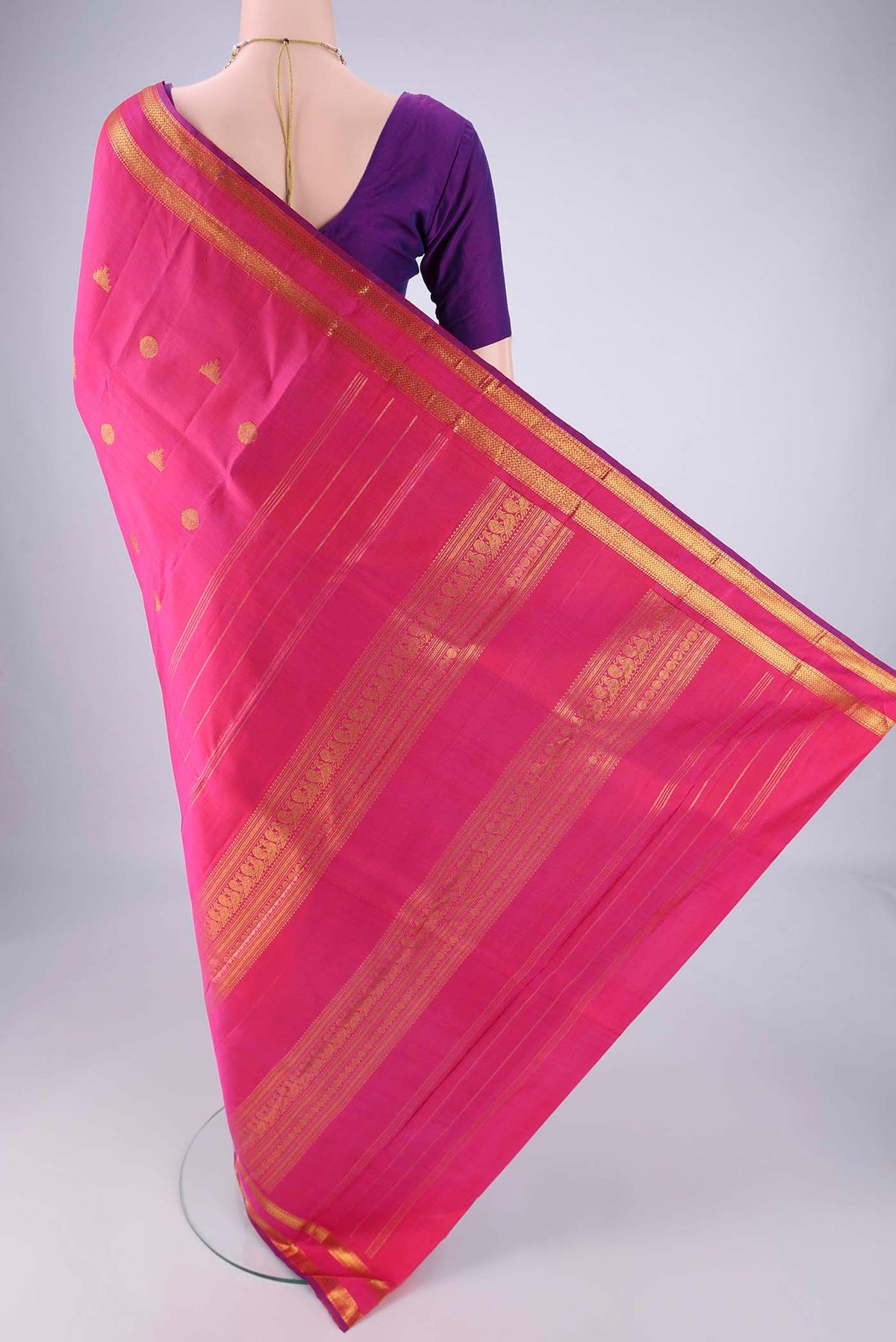 Flat view of Pink Kanjivaram Silk Saree with Zari Butta on the body and Zari Border. 