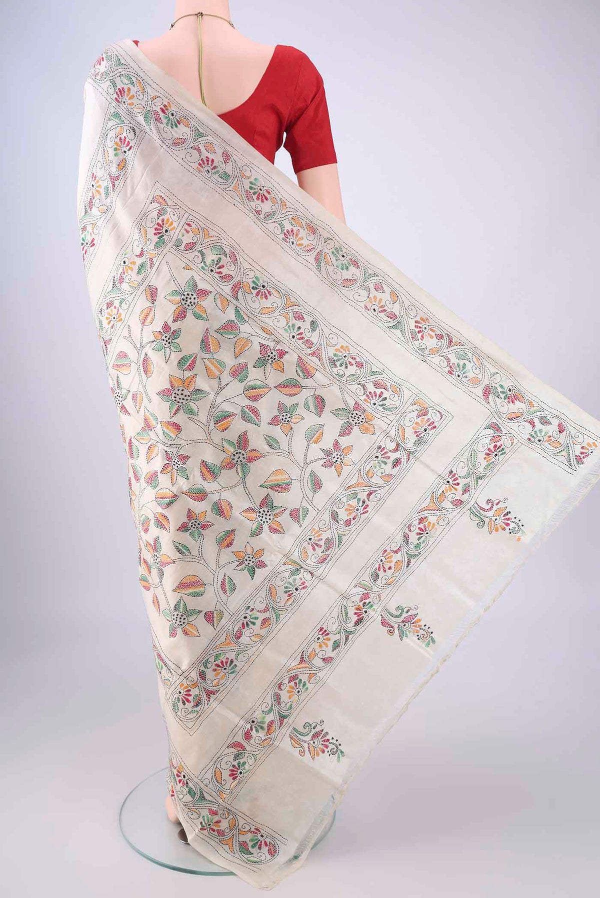 Flat view of Cream Tussar Silk Saree with Kantha Work on the body and Thread Border. 