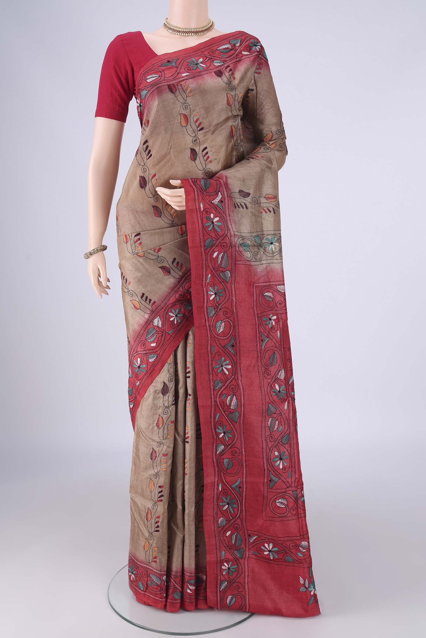 Brown Tussar Silk Saree with Kantha Work on the body and Thread Border.  displayed on a mannequin