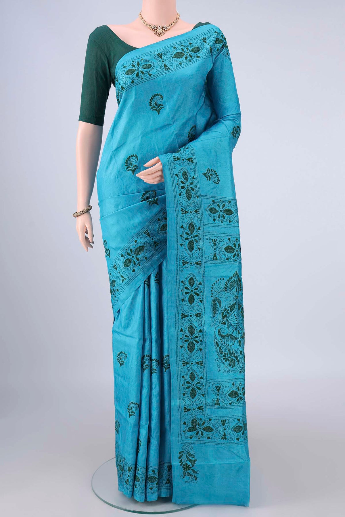 Blue Tussar Saree with Kantha Work on the body and Thread Border.  displayed on a mannequin