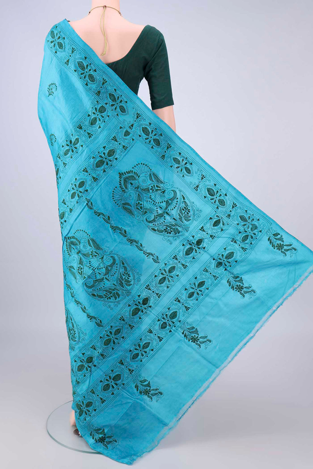 Flat view of Blue Tussar Saree with Kantha Work on the body and Thread Border. 