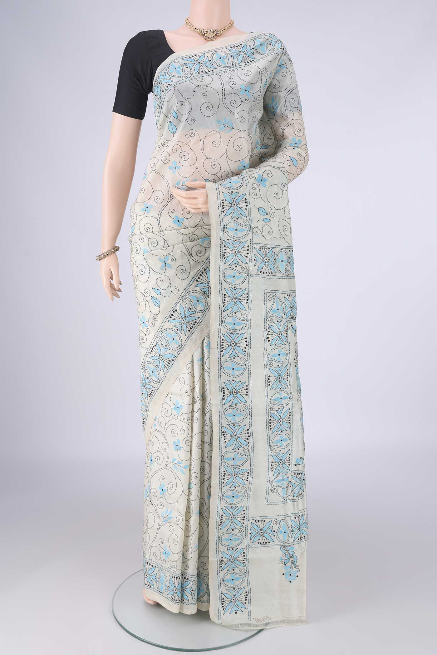 Beige Tussar Silk Saree with Kantha Work on the body and Thread Border.  displayed on a mannequin