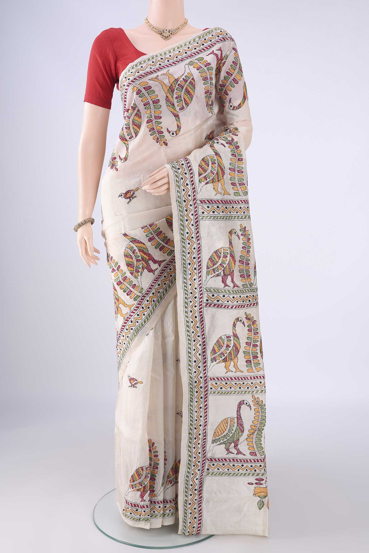 Acid Green Tussar Silk Saree with Kantha Work on the body and Thread Border.  displayed on a mannequin