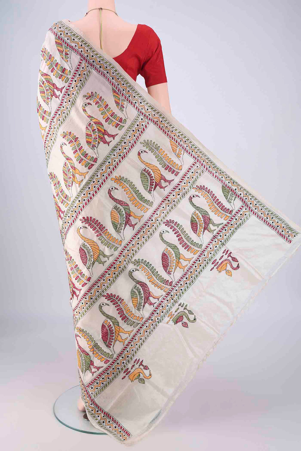 Flat view of Acid Green Tussar Silk Saree with Kantha Work on the body and Thread Border. 