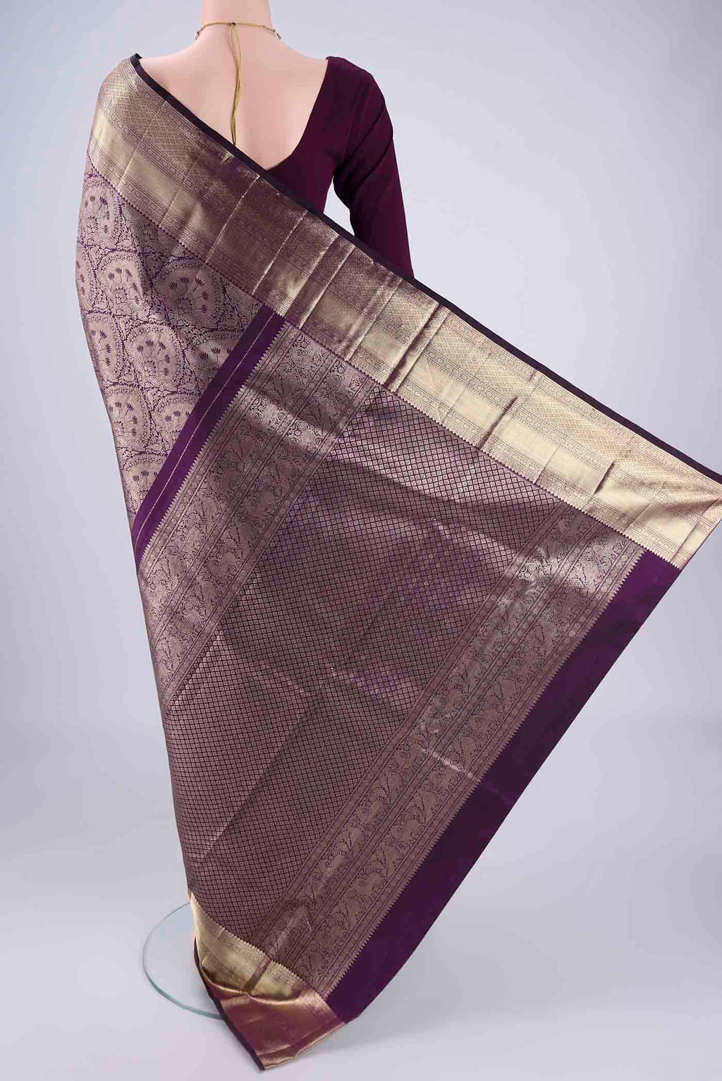 Flat view of Purple Kanchipuram Silk Saree with Zari Brocade on the body and Zari Border. 